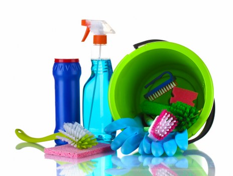 Cleaning professional wearing PPE during a deep cleaning task