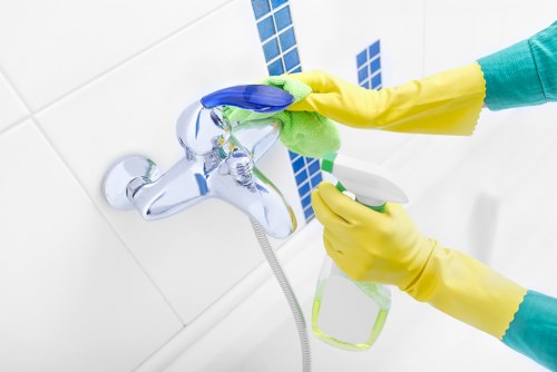 Professional cleaner maintaining a Bayswater meeting room